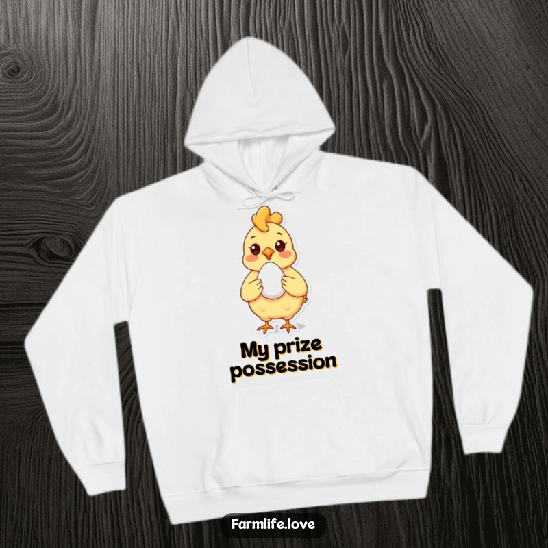 Funny Hoodie with a proud chicken showing off a perfect egg, offering cozy humor and farm-fresh charm.