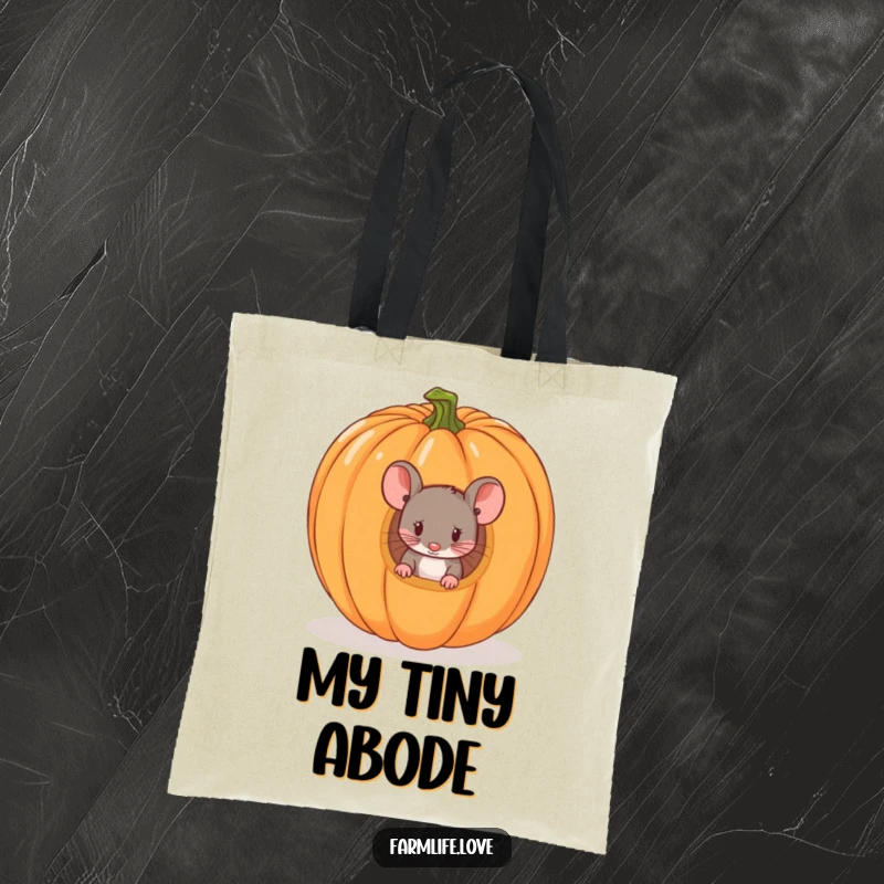 Funny tote bag depicting a tiny mouse peeking from a ripe pumpkin, a practical and humorous accessory for autumn enthusiasts.